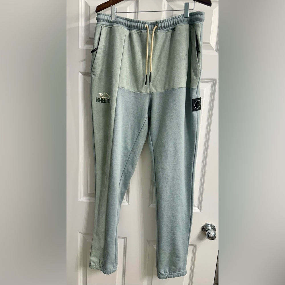 These Civilized sweatpants, size XL, feature a two-tone design with "BAD HABITS
